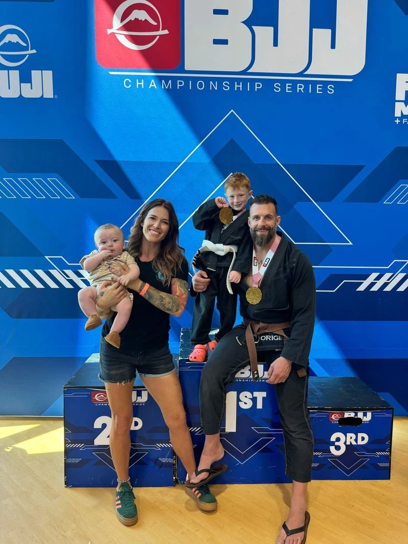 Nick Koumalatsos with his family after a jiu-jitsu tournament